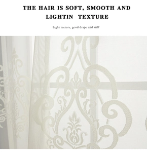Detail of white semi-sheer curtain featuring elegant damask floral embroidery pattern