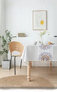Detail of Nordic floral tablecloth with beige tassels and waterproof cotton linen texture