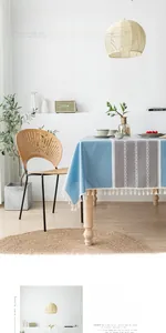 Detail of Nordic printed PVC tablecloth featuring blue-grey geometry and white tassel trim