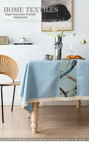 Close-up of blue cotton linen tablecloth with high precision chain print and lace edge