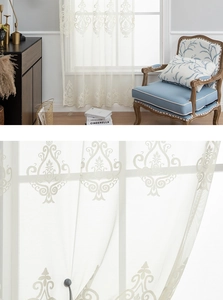 Detailed view of white damask lace curtain with intricate embroidery for window decor