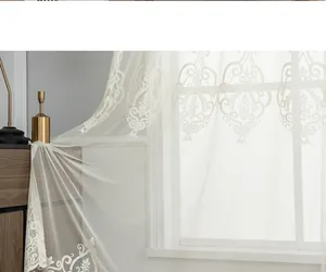 Detail of white lace sheer curtain with black tassel and Damascus floral embroidery
