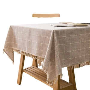 Thick linen cotton tablecloth with beige grid pattern and decorative fringe tassels