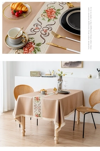 Close-up of floral embroidery and elegant lace edge on a premium rectangle tablecloth