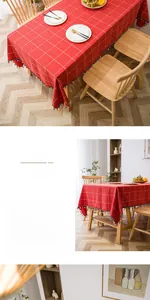 Detail of red checkered tablecloth with cotton linen texture and decorative colorful tassels