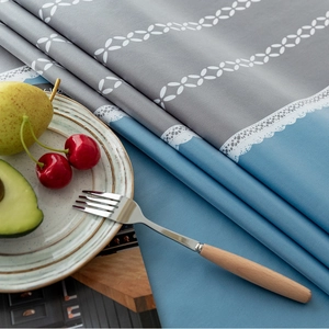 Nordic waterproof PVC tablecloth featuring blue and grey color blocking with lace patterns