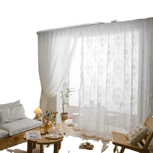 White lace sheer curtain with elegant floral embroidery and ruffled edges for living room