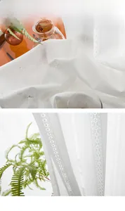 Macro shot of white hollow lace sheer curtains with delicate geometric knit patterns