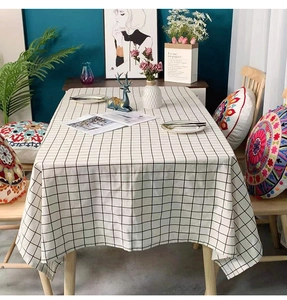 Detail of minimalist black and white checkered tablecloth with high-quality linen texture