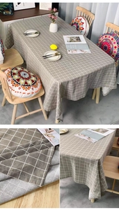 Detail of grey checkered cotton linen tablecloth showing premium fabric texture and neat seams