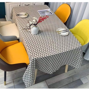 Close-up of grey and white geometric triangle pattern on modern minimalist tablecloth