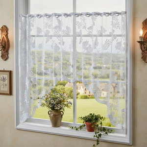 White Nordic lace cafe curtain with butterfly floral patterns and wavy scalloped edges
