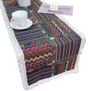 Bohemian style table runner with geometric wave print and delicate white lace edges