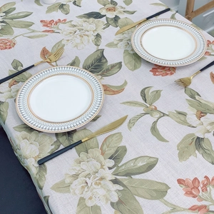 Pastoral linen table cloth with green floral prints on a rectangle dining table