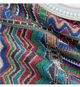 Close-up of thick woven ethnic tablecloth with colorful geometric zigzag patterns