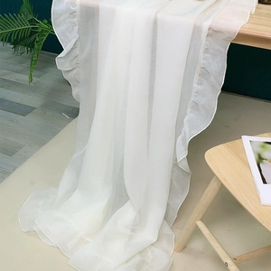 Minimalist white translucent tablecloth with elegant ruffle edges for home decor
