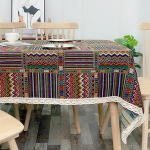 Ethnic bohemian tablecloth with colorful geometric patterns and white lace edges
