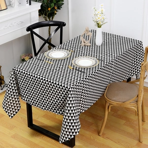 Detail of waterproof PVC tablecloth with modern black and white geometric triangle pattern