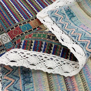 Ethnic style woven tablecloth with colorful geometric patterns and white lace edges