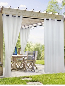 Close-up of white waterproof outdoor curtains with metal grommets on a wooden gazebo