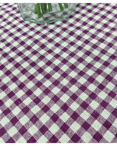 Close-up of purple and white plaid cotton linen tablecloth with lace weave texture