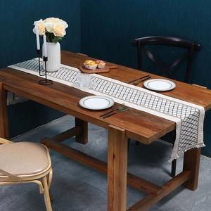 Boho woven cotton linen table runner with black diamond patterns and fringed tassels