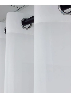 Detail of silver metal grommet top and semi-sheer white fabric for outdoor gazebo curtains