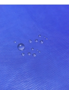 Detailed close-up of blue waterproof outdoor curtain fabric with hydrophobic water droplets