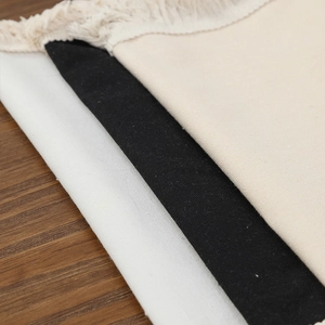 Modern minimalist heat-resistant placemats with fringe in white, black and beige