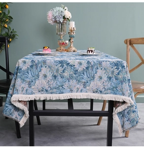 Blue floral jacquard tablecloth with white tassels and elegant woven texture
