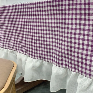Purple and white gingham checkered tablecloth with elegant white ruffled lace edge