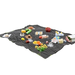 Portable black and white checkered picnic mat with waterproof fabric for outdoor camping