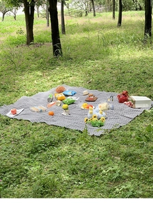 Outdoor picnic mat with grey chevron pattern showcasing spacious capacity for snacks