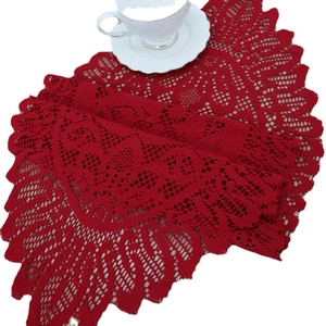 Elegant red lace table runner with hollowed floral patterns and scalloped leaf edges