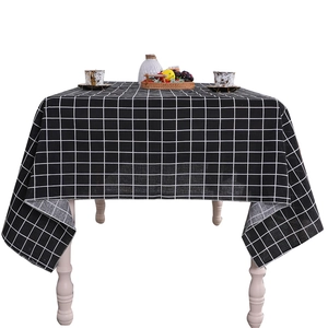 Minimalist black and white checkered linen tablecloth for a modern dining table decoration