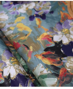 Macro detail of waterproof oil painting tablecloth with vibrant floral prints on teal fabric