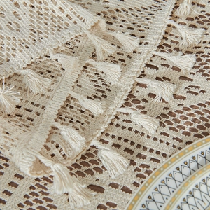 Vintage crochet tablecloth with hollow geometric patterns and elegant beige tassels
