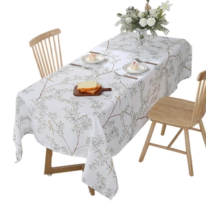 Nordic rectangular tablecloth featuring green leaves and birds on white fabric