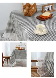 Close-up of black and white checkered cotton linen tablecloth with white lace edges