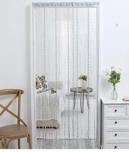 Detail of silver gray tassel string curtain with water drop beads for home decoration