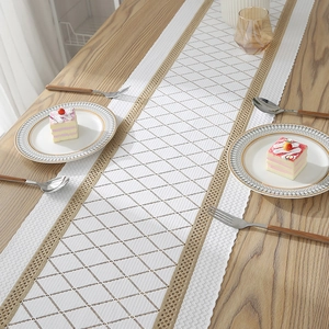 Modern white lace table runner with diamond grid hollow texture and wavy scalloped edges