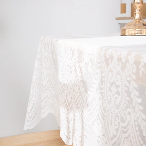 White lace rectangular tablecloth with floral embroidery and wavy scalloped edges