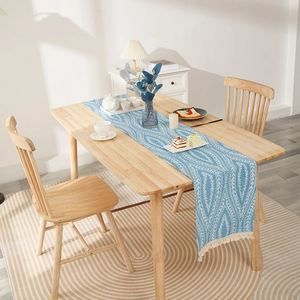 Modern light blue table runner with white leaf patterns and beige tassel decorations