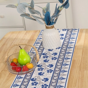 Modern minimalist table runner with blue and grey bohemian floral patterns and tassels