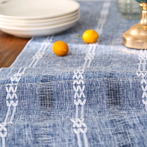 Blue hand-woven cotton linen table runner with white geometric embroidery for dining decor