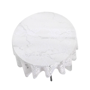Modern white round lace tablecloth featuring intricate hollow-out floral patterns