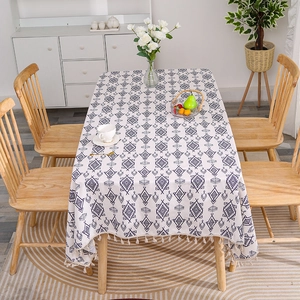 Linen cotton tablecloth with navy geometric diamond pattern and elegant beige tassels