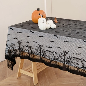 Halloween black lace tablecloth featuring flying bats and spooky dead trees for festive decor