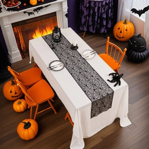 Halloween black lace table runner with spider web design on white background