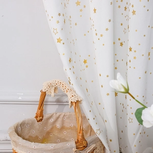 White semi-blackout curtains with golden star patterns for a modern minimalist bedroom